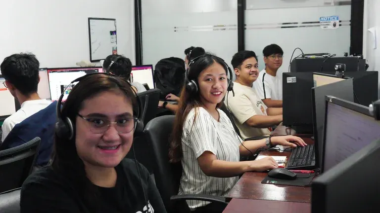Clark Staff call center outsourcing team at office workstations