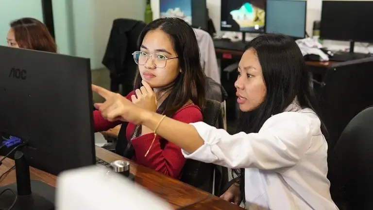 Clark Staff outsourced accounting colleagues working together at their monitors